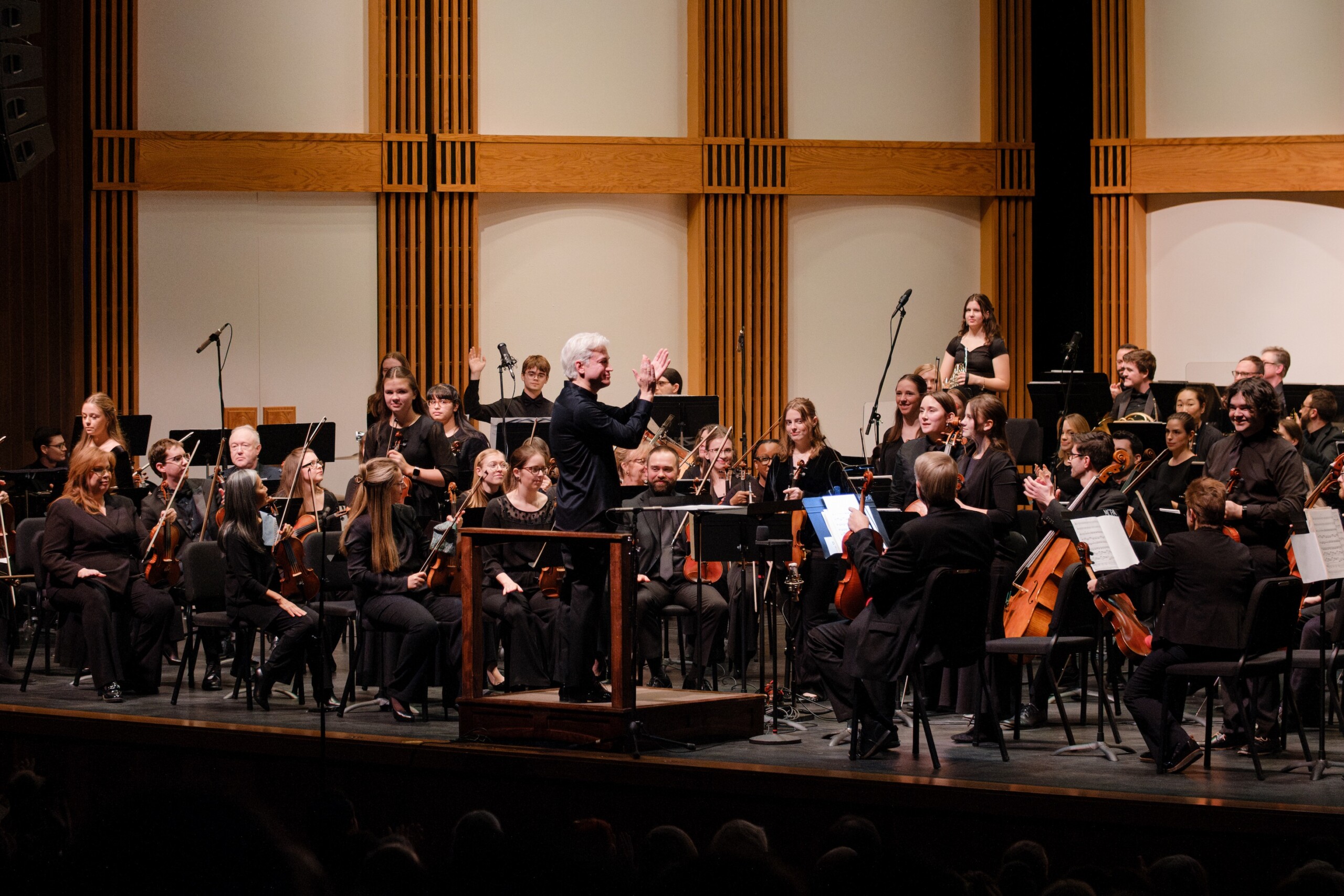 Boise Phil musicians acknowledge applause on stage.